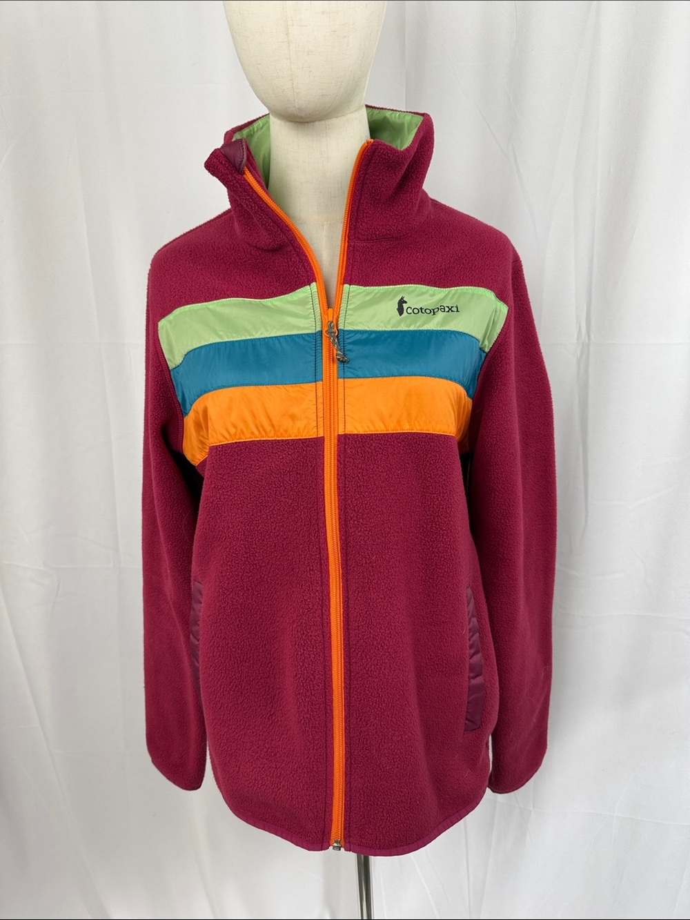 cotopaxi Raspberry Fleece Jacket with Green, Blue & Orange Stripes